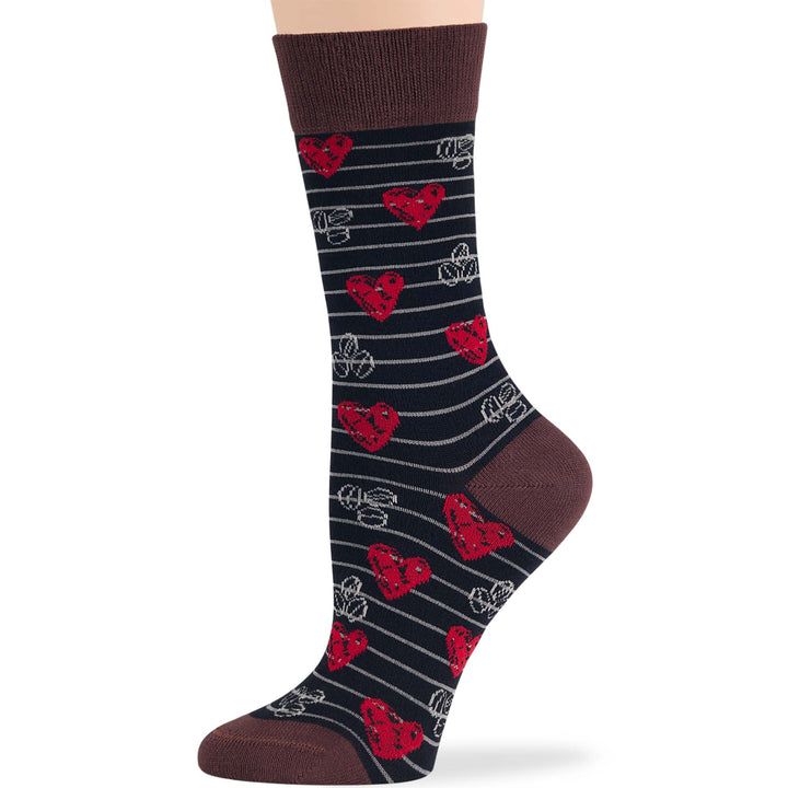 Women's bamboo novelty crew sock featuring heart and coffee cup pattern on a black background, brown cuff.