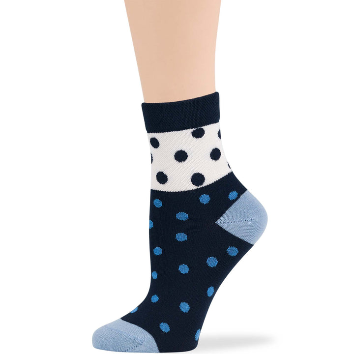 Women's quarter diabetic socks in dark navy with blue and white polka dots. Cotton blend for comfort and seamless design for non-binding fit.